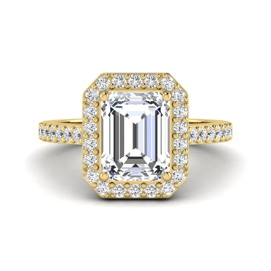 IGI Certified 2.75 carat emerald cut lab grown diamond halo engagement ring with pavé diamond band in yellow gold.