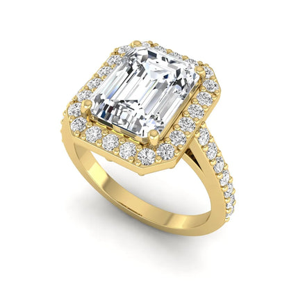 IGI Certified 2.75 carat emerald cut lab grown diamond halo engagement ring with pavé diamond band in yellow gold.