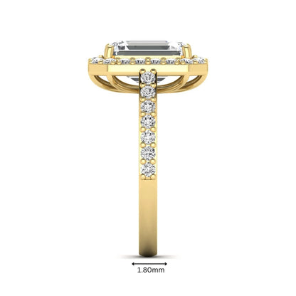 IGI Certified 2.75 carat emerald cut lab grown diamond halo engagement ring with pavé diamond band in yellow gold.