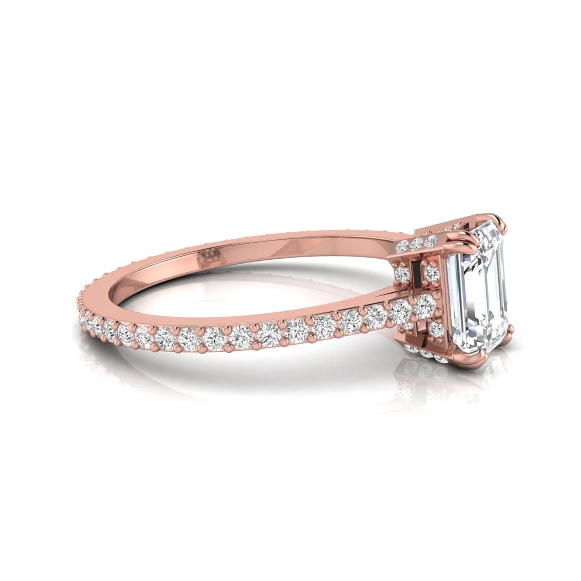 Emerald cut lab grown diamond engagement ring with hidden halo, pavé band, and four-prong setting in rose gold tone design