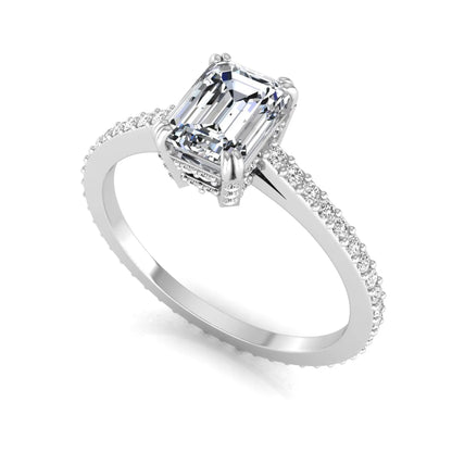 Emerald cut lab grown diamond engagement ring with hidden halo, pavé band, and four-prong setting in white gold tone design