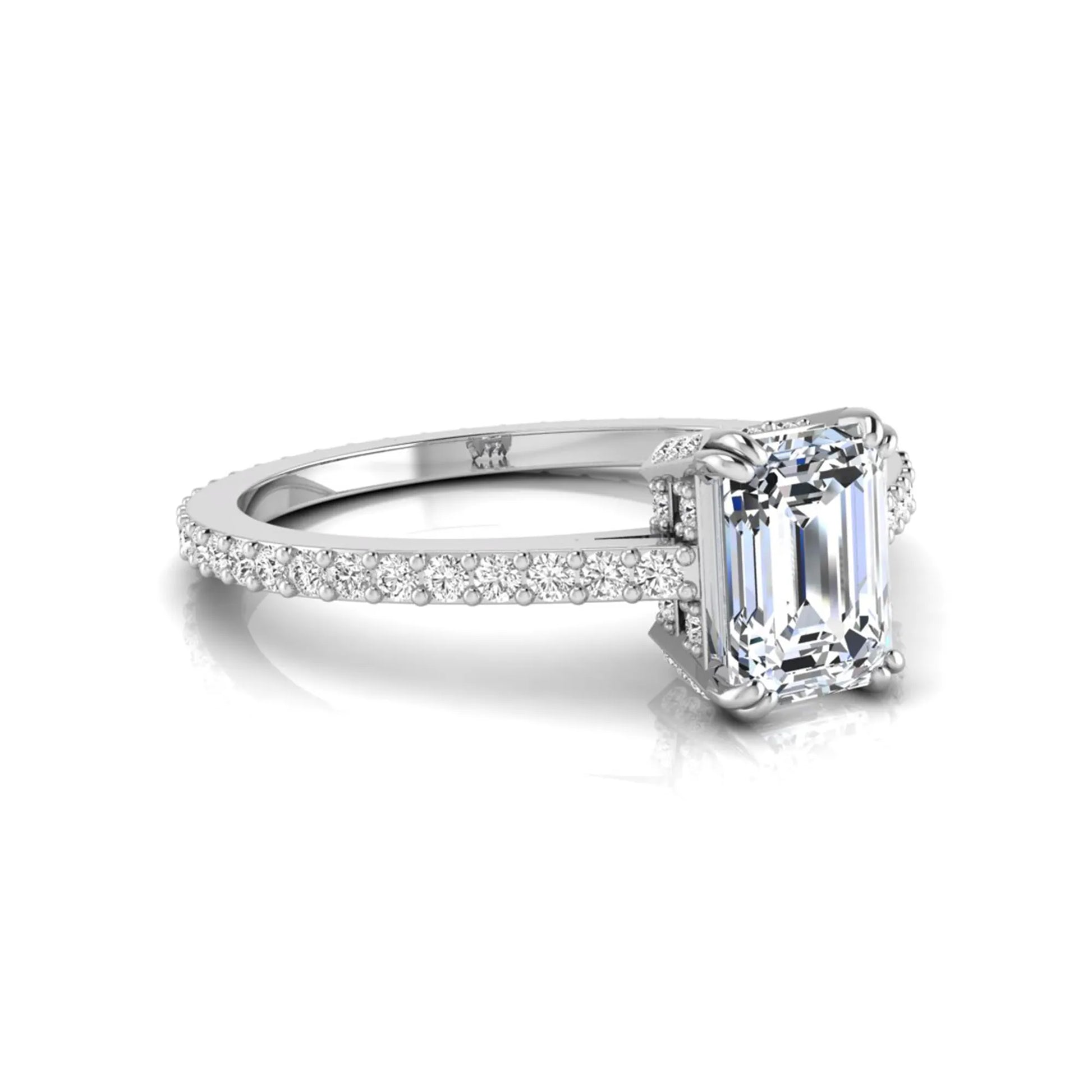 Emerald cut lab grown diamond engagement ring with hidden halo, pavé band, and four-prong setting in white gold tone design