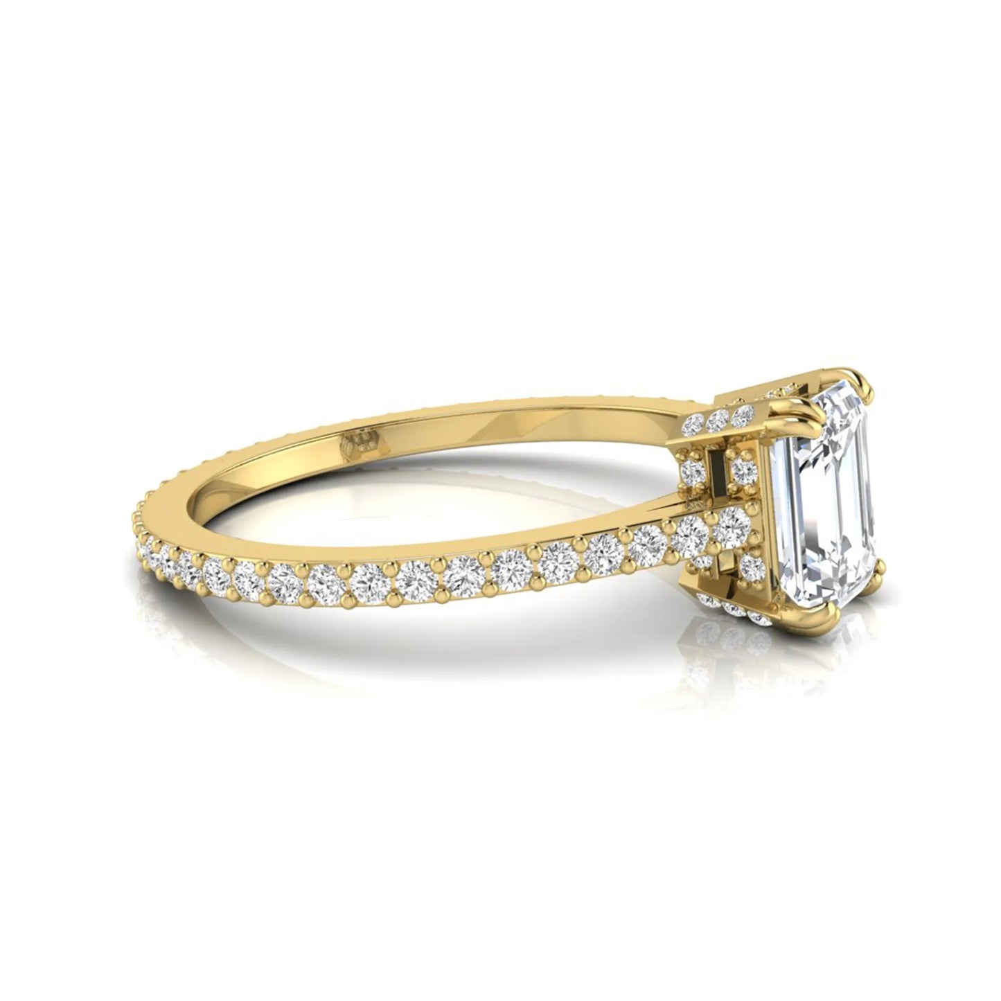Emerald cut lab grown diamond engagement ring with hidden halo, pavé band, and four-prong setting in yellow gold tone design
