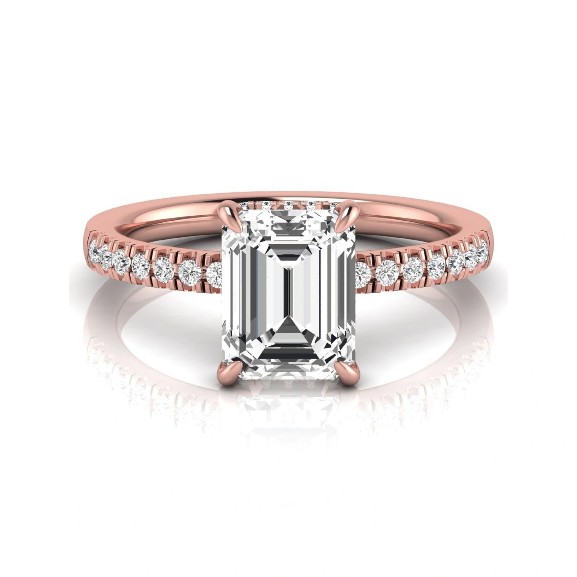 Emerald cut lab grown diamond engagement ring featuring a hidden halo, pavé diamond band, and four-prong setting in rose gold tone.