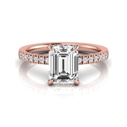 Emerald cut lab grown diamond engagement ring featuring a hidden halo, pavé diamond band, and four-prong setting in rose gold tone.