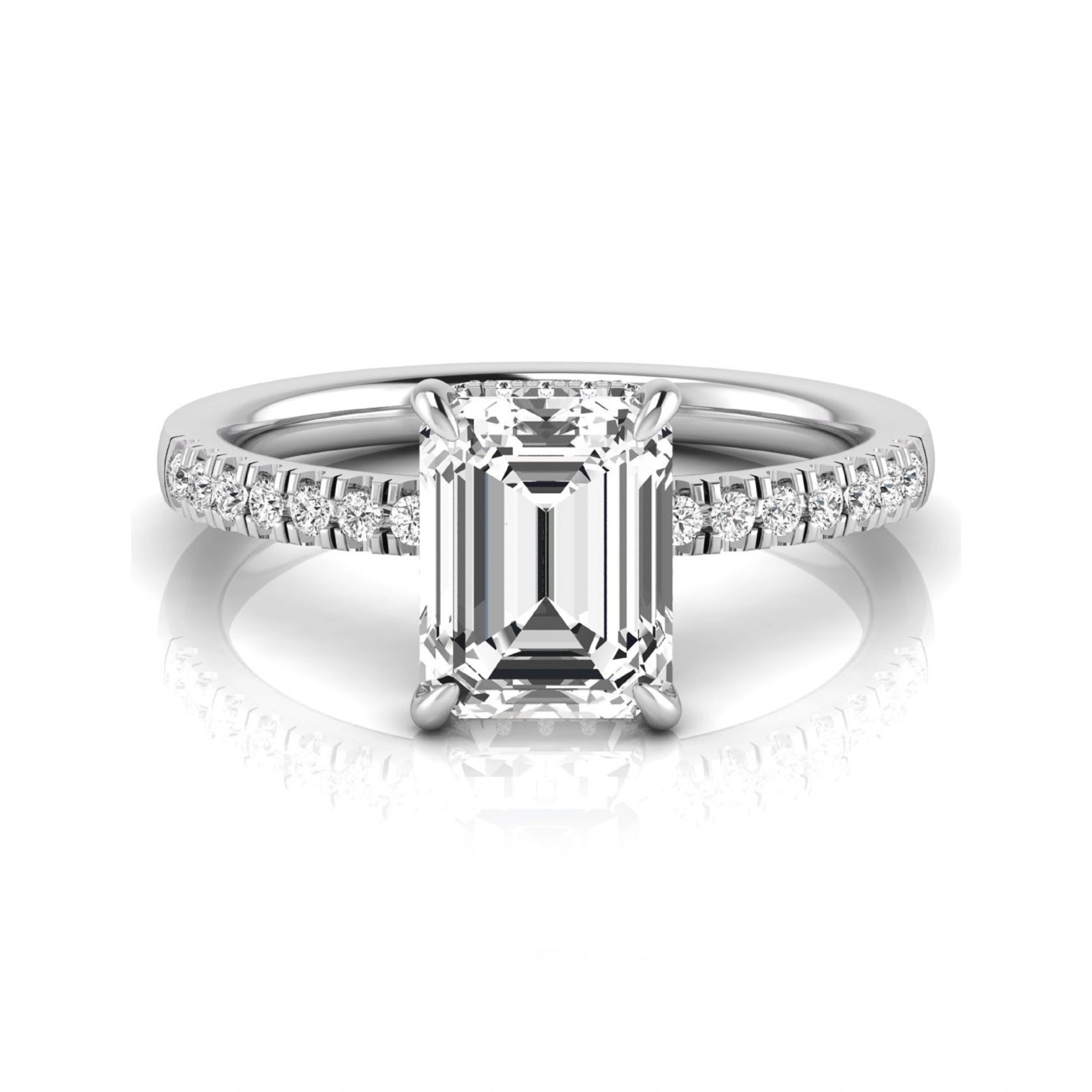 Emerald cut lab grown diamond engagement ring featuring a hidden halo, pavé diamond band, and four-prong setting in white gold tone.