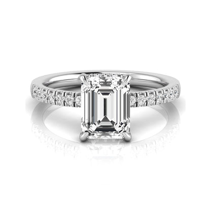 Emerald cut lab grown diamond engagement ring featuring a hidden halo, pavé diamond band, and four-prong setting in white gold tone.