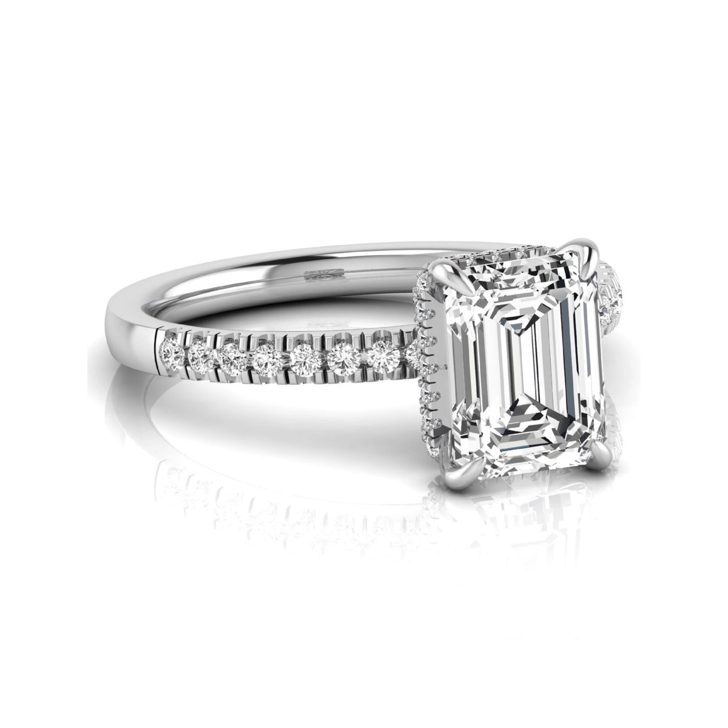 Emerald cut lab grown diamond engagement ring featuring a hidden halo, pavé diamond band, and four-prong setting in white gold tone.
