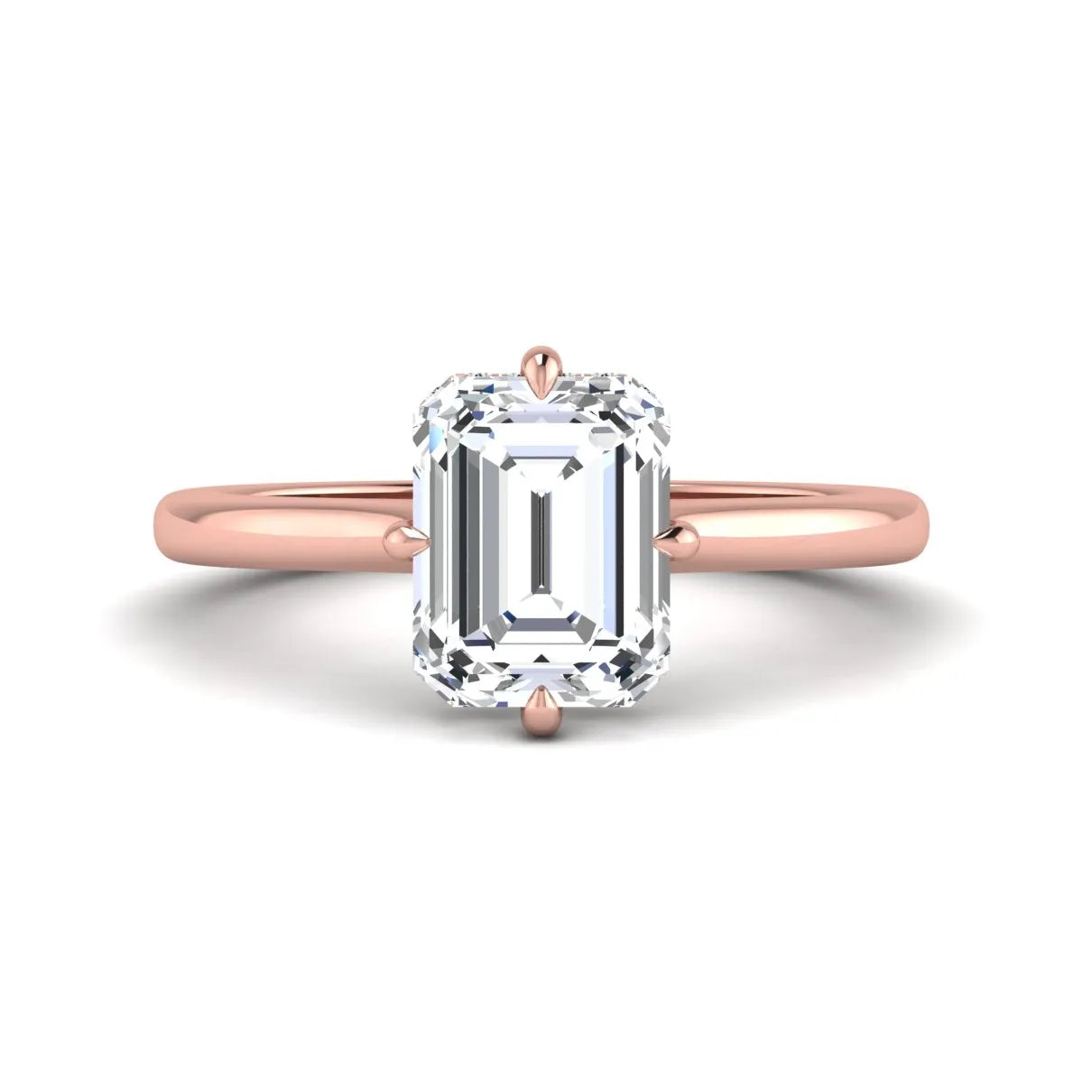Emerald cut lab grown diamond hidden halo solitaire engagement ring featuring a four-prong setting on a polished rose gold band.