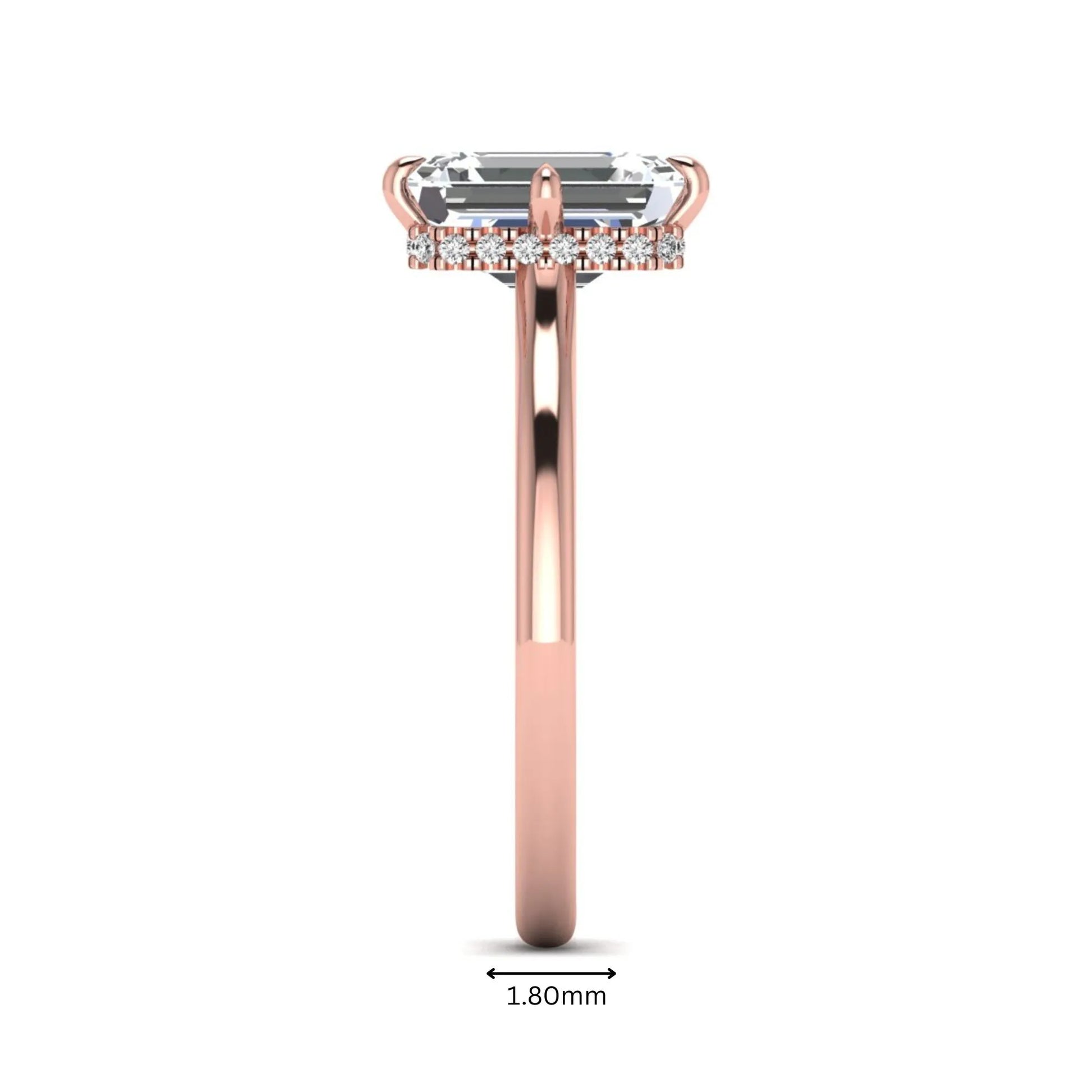 Emerald cut lab grown diamond hidden halo solitaire engagement ring featuring a four-prong setting on a polished rose gold band.