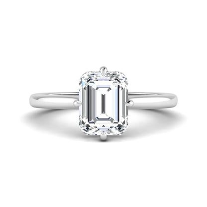 Emerald cut lab grown diamond hidden halo solitaire engagement ring featuring a four-prong setting on a polished white gold band.