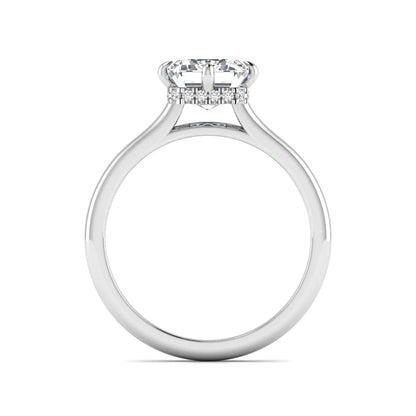 Emerald cut lab grown diamond hidden halo solitaire engagement ring featuring a four-prong setting on a polished white gold band.
