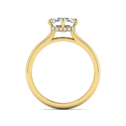 Emerald cut lab grown diamond hidden halo solitaire engagement ring featuring a four-prong setting on a polished yellow gold band.