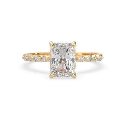 Emerald cut lab grown diamond engagement ring with pavé princess and round diamond accents in yellow gold