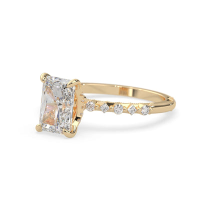 Emerald cut lab grown diamond engagement ring with pavé princess and round diamond accents in yellow gold