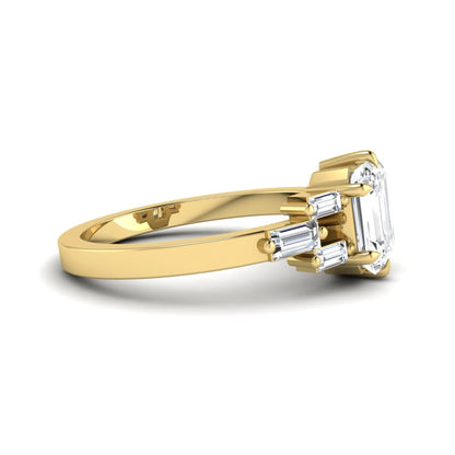 Emerald cut lab grown diamond engagement ring featuring an IGI certified center diamond with three-row baguette diamond shoulders in yellow gold.