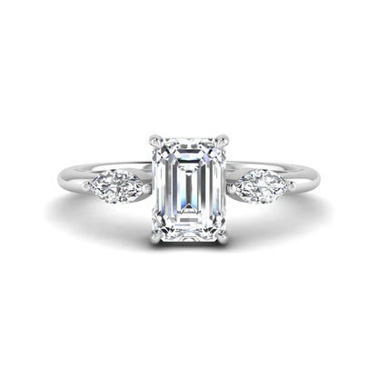 Emerald cut three stone lab grown diamond engagement ring featuring a 1.06 carat IGI certified center diamond with marquise side diamonds in white gold.