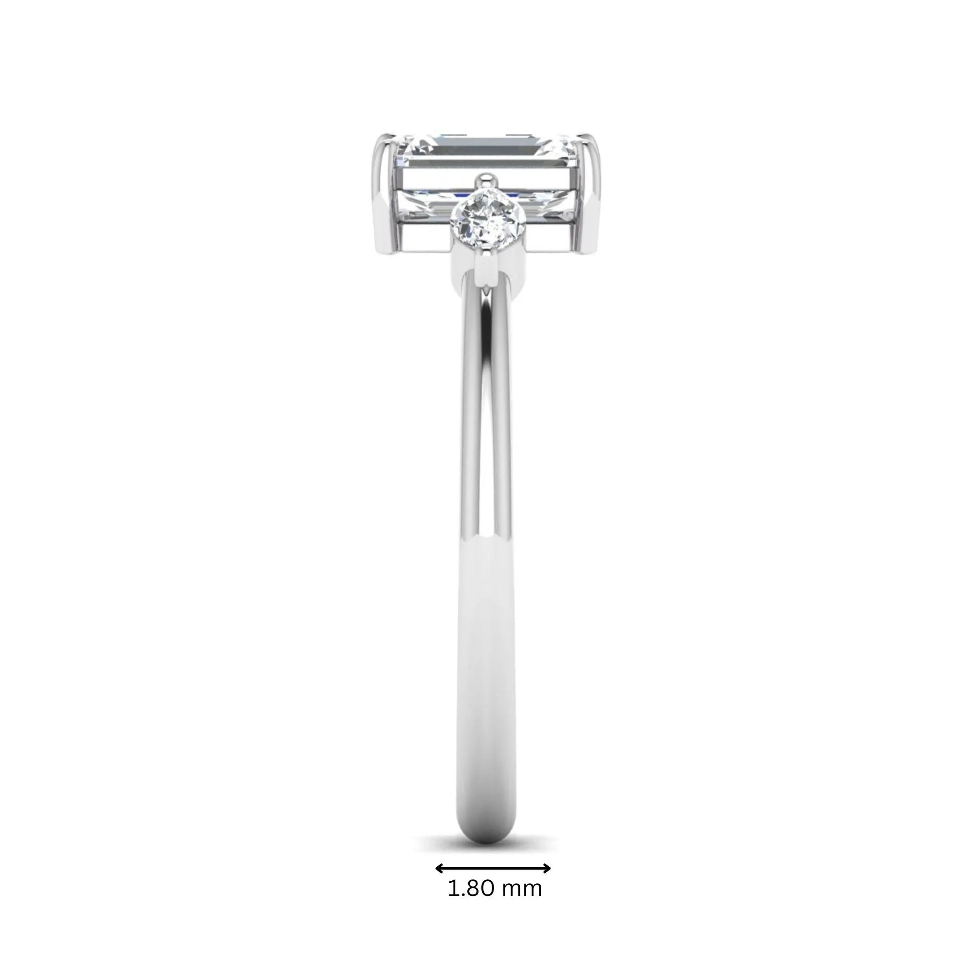Emerald cut three stone lab grown diamond engagement ring featuring a 1.06 carat IGI certified center diamond with marquise side diamonds in white gold.