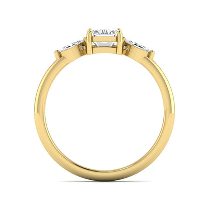 Emerald cut three stone lab grown diamond engagement ring featuring a 1.06 carat IGI certified center diamond with marquise side diamonds in yellow gold.