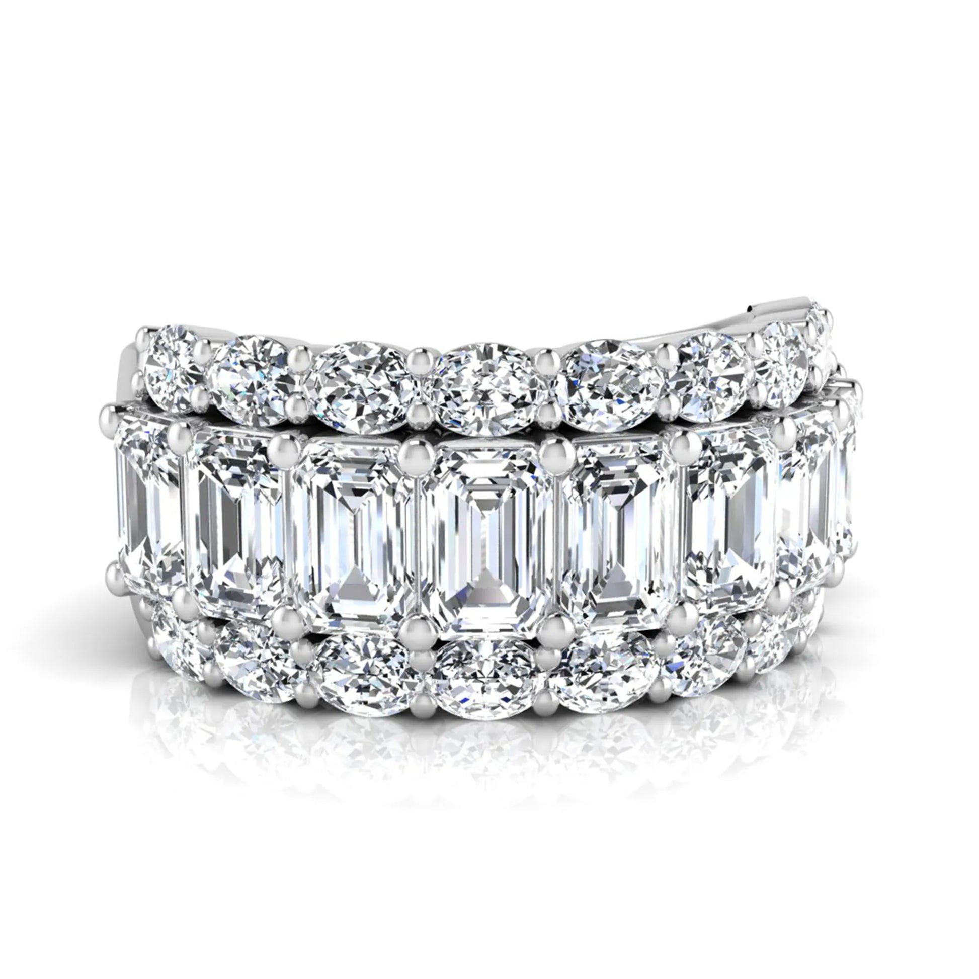 Emerald and oval cut lab grown diamond wide band ring featuring shared prong setting in white gold design