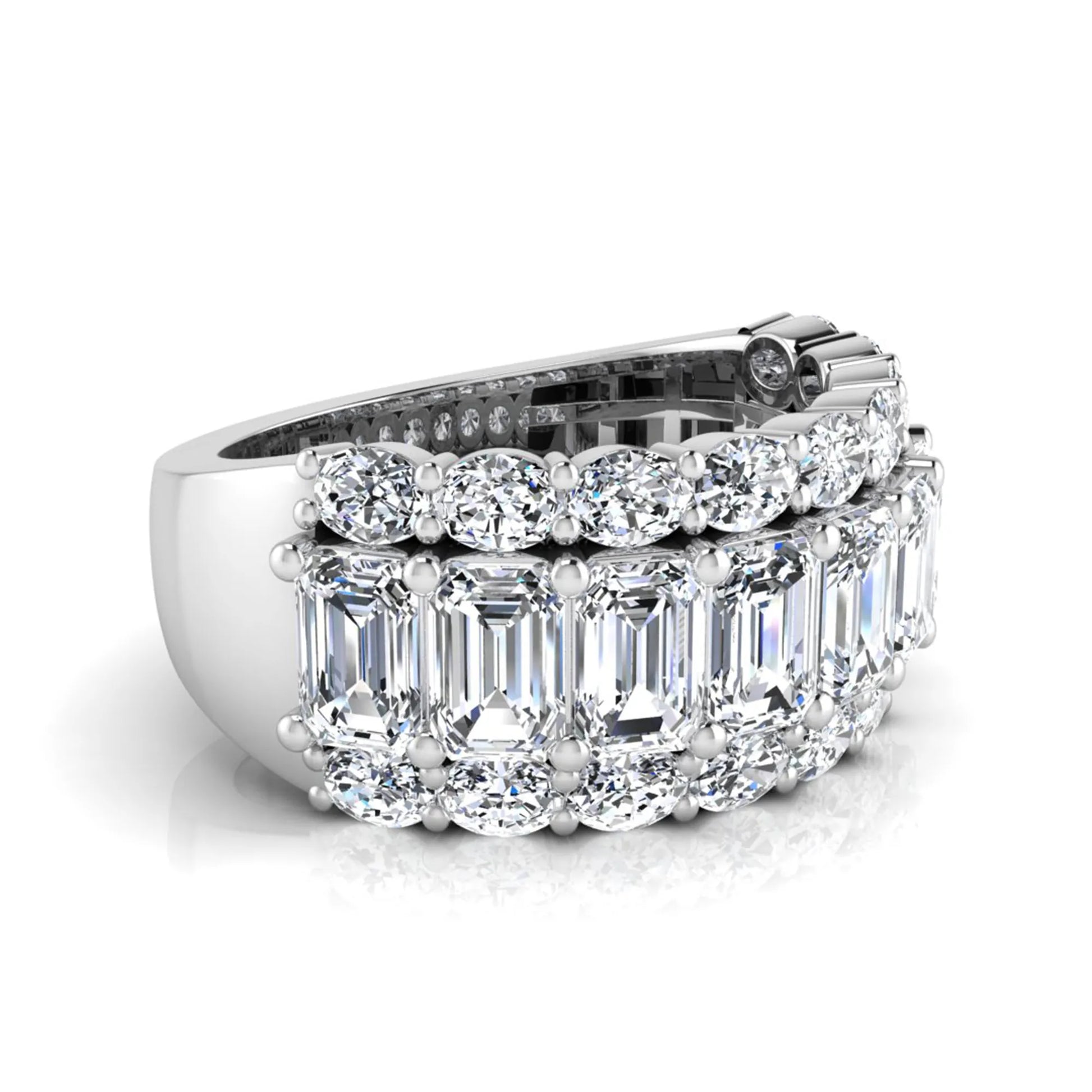 Emerald and oval cut lab grown diamond wide band ring featuring shared prong setting in white gold design