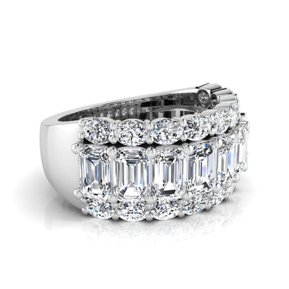 Emerald and oval cut lab grown diamond wide band ring featuring shared prong setting in white gold design