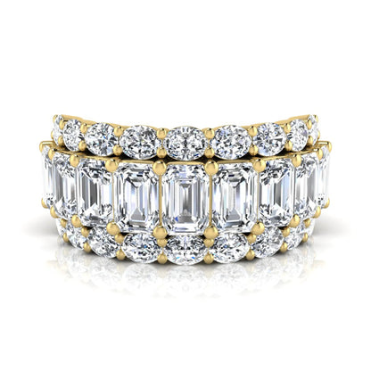 Emerald and oval cut lab grown diamond wide band ring featuring shared prong setting in yellow gold design