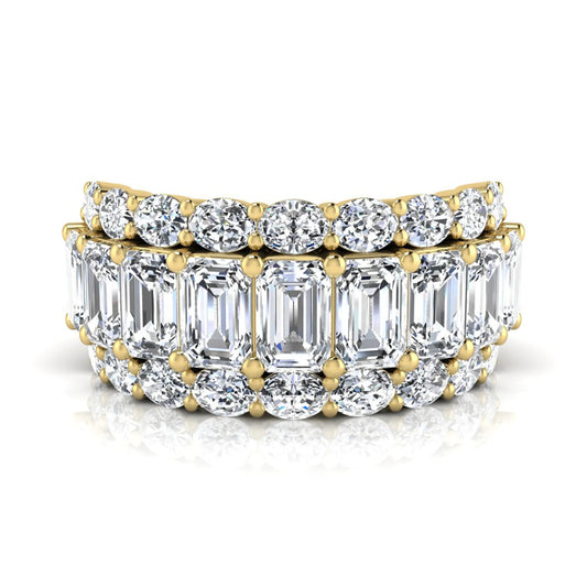 Emerald and oval cut lab grown diamond wide band ring featuring shared prong setting in yellow gold design