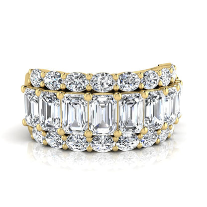 Emerald and oval cut lab grown diamond wide band ring featuring shared prong setting in yellow gold design