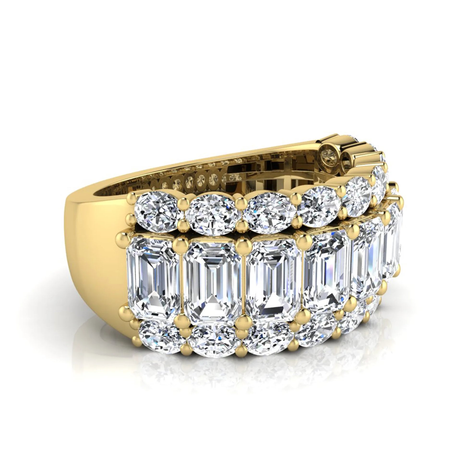 Emerald and oval cut lab grown diamond wide band ring featuring shared prong setting in yellow gold design