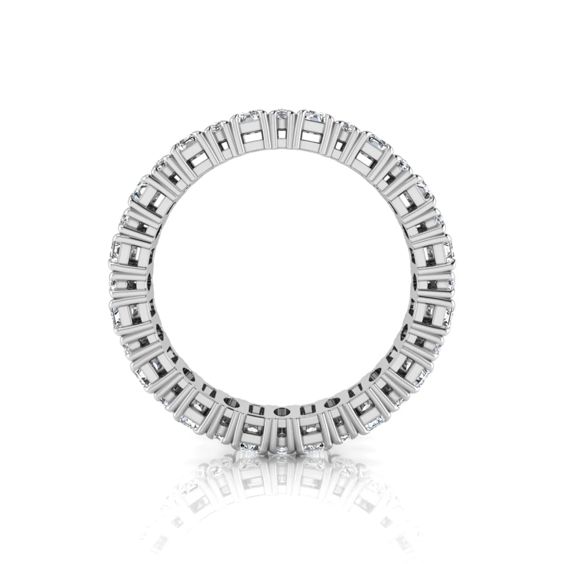 Emerald and oval cut lab grown diamond eternity band ring with alternating diamonds in a shared prong setting and white gold style.