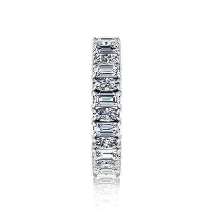 Emerald and oval cut lab grown diamond eternity band ring with alternating diamonds in a shared prong setting and white gold style.
