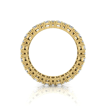 Emerald and oval cut lab grown diamond eternity band ring with alternating diamonds in a shared prong setting and yellow gold style.