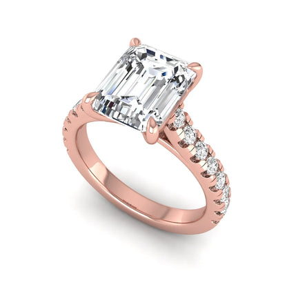 Emerald cut lab grown diamond engagement ring with pavé round diamonds in a rose gold four-prong cathedral setting