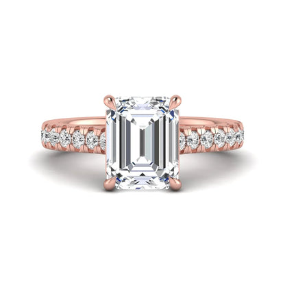 Emerald cut lab grown diamond engagement ring with pavé round diamonds in a rose gold four-prong cathedral setting
