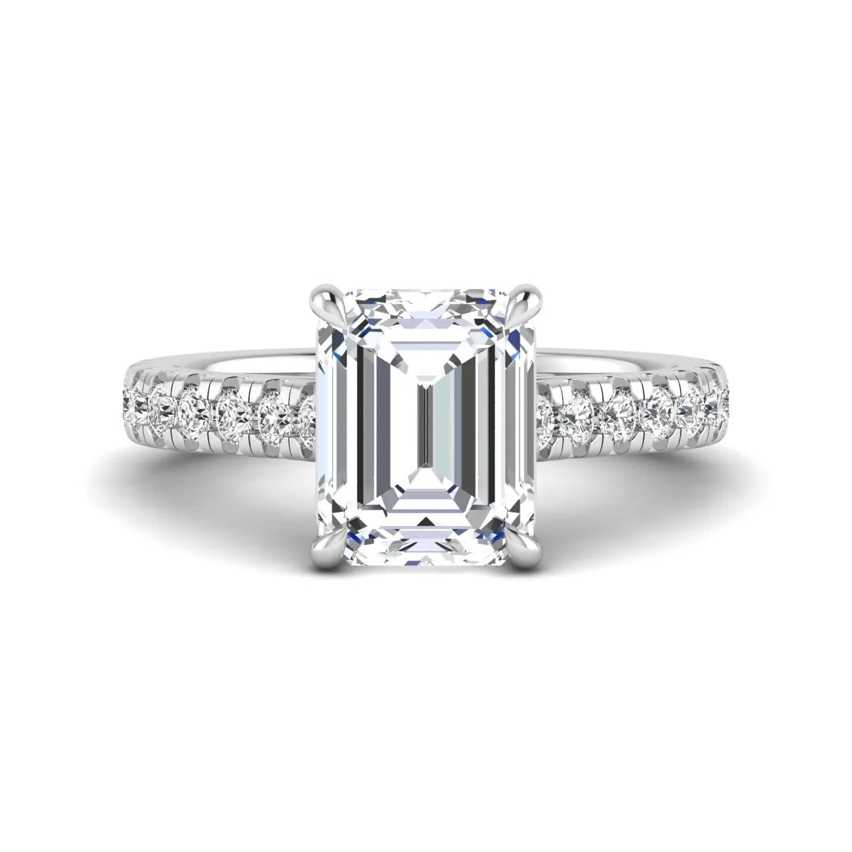 Emerald cut lab grown diamond engagement ring with pavé round diamonds in a white gold four-prong cathedral setting