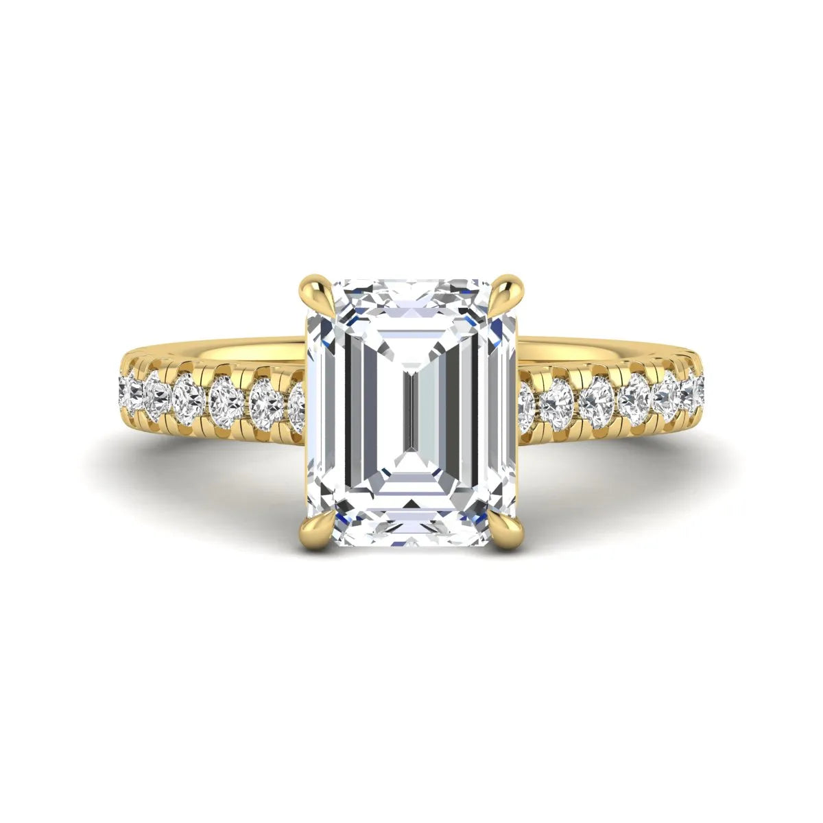 Emerald cut lab grown diamond engagement ring with pavé round diamonds in a yellow gold four-prong cathedral setting