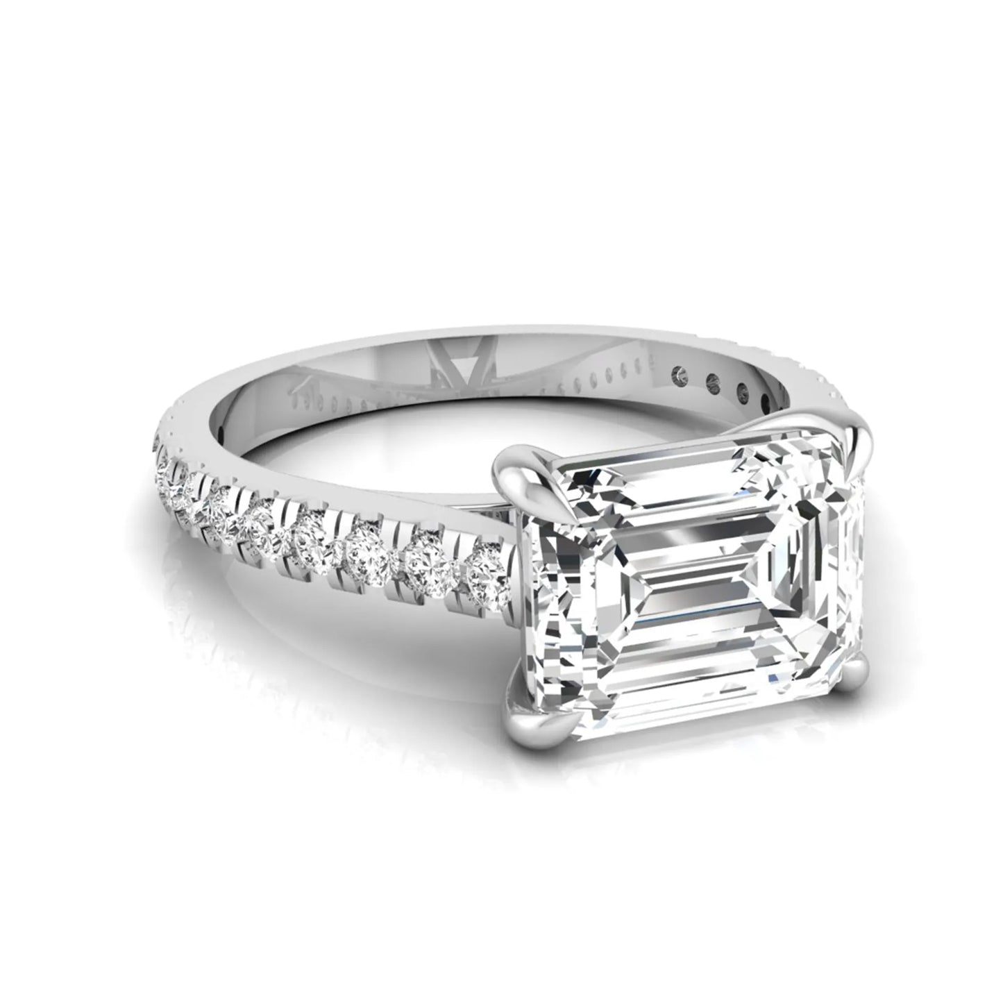 Emerald cut lab grown diamond solitaire engagement ring featuring a four-prong setting with a pavé diamond band in white gold tone.