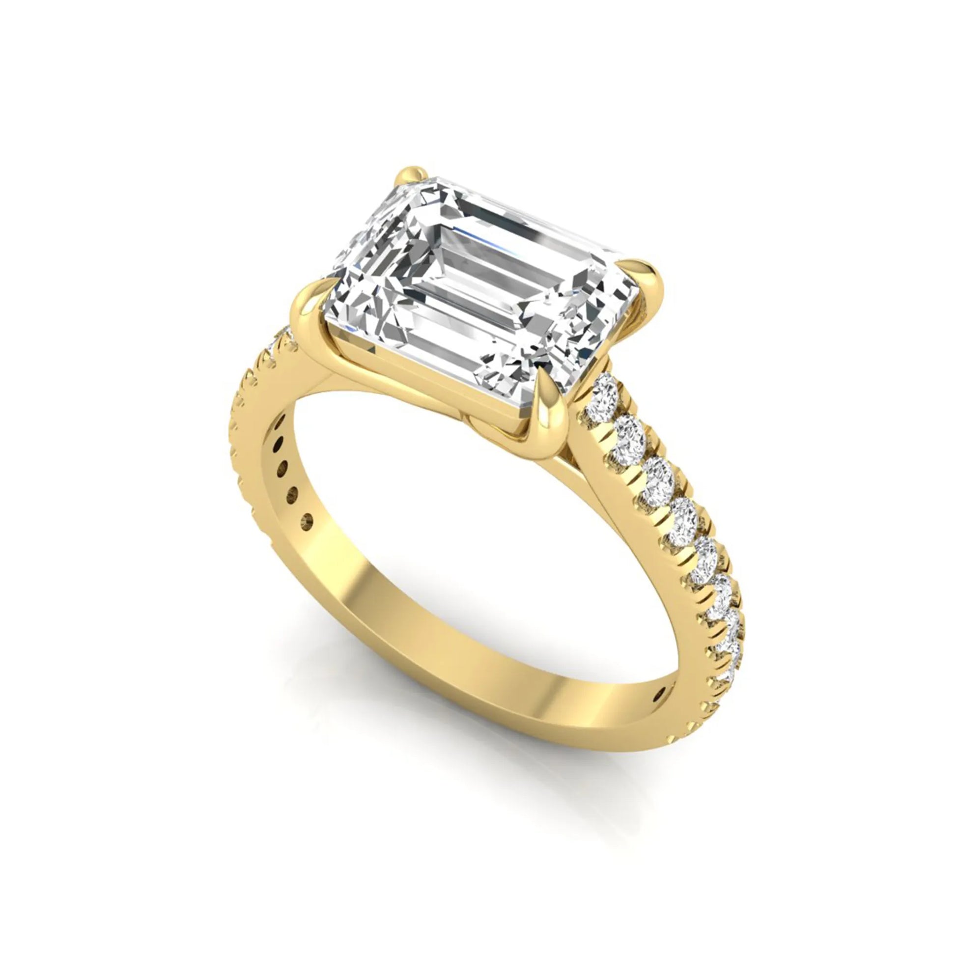 Emerald cut lab grown diamond solitaire engagement ring featuring a four-prong setting with a pavé diamond band in yellow gold tone.
