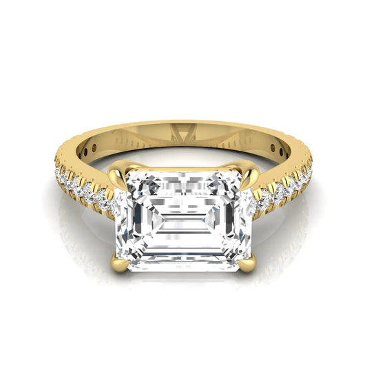 Emerald cut lab grown diamond solitaire engagement ring featuring a four-prong setting with a pavé diamond band in yellow gold tone.