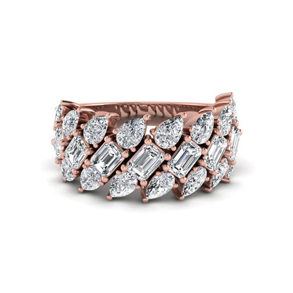 Emerald and pear cut lab grown diamond cluster ring with prong setting in rose gold tone wide band design.