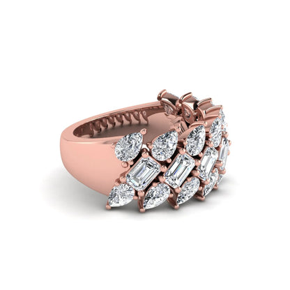 Emerald and pear cut lab grown diamond cluster ring with prong setting in rose gold tone wide band design.