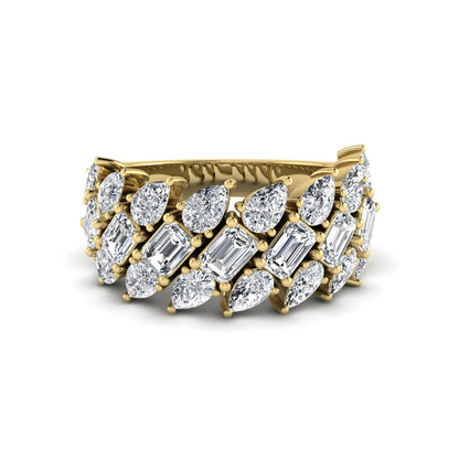 Emerald and pear cut lab grown diamond cluster ring with prong setting in yellow gold tone wide band design.