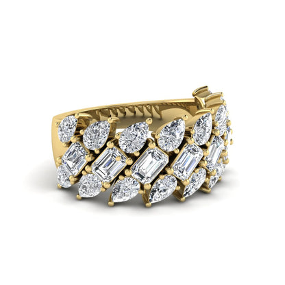 Emerald and pear cut lab grown diamond cluster ring with prong setting in yellow gold tone wide band design.