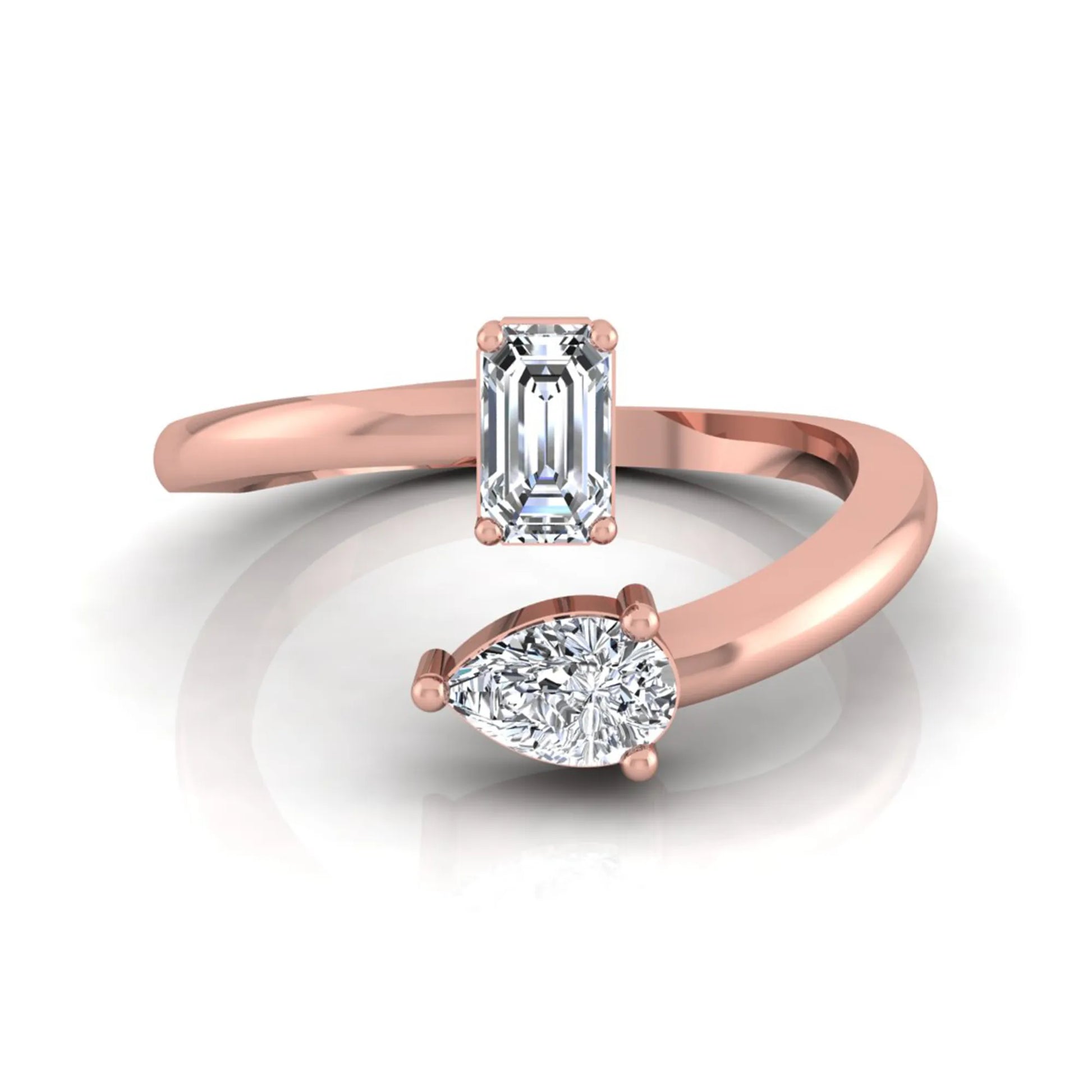 Emerald and pear cut lab grown diamond Toi et Moi ring featuring a minimalist open design in rose gold