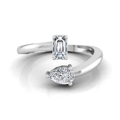 Emerald and pear cut lab grown diamond Toi et Moi ring featuring a minimalist open design in white gold