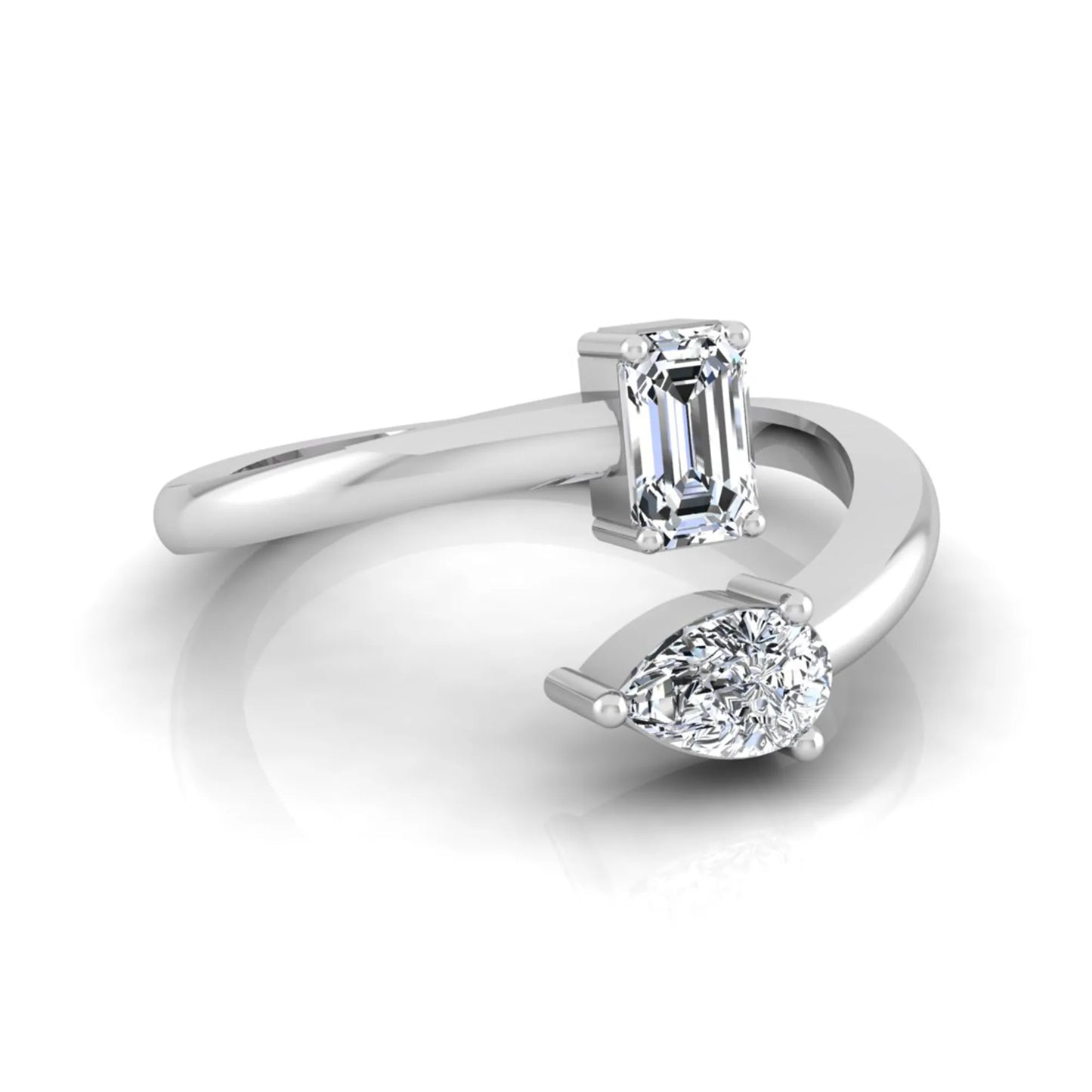 Emerald and pear cut lab grown diamond Toi et Moi ring featuring a minimalist open design in white gold