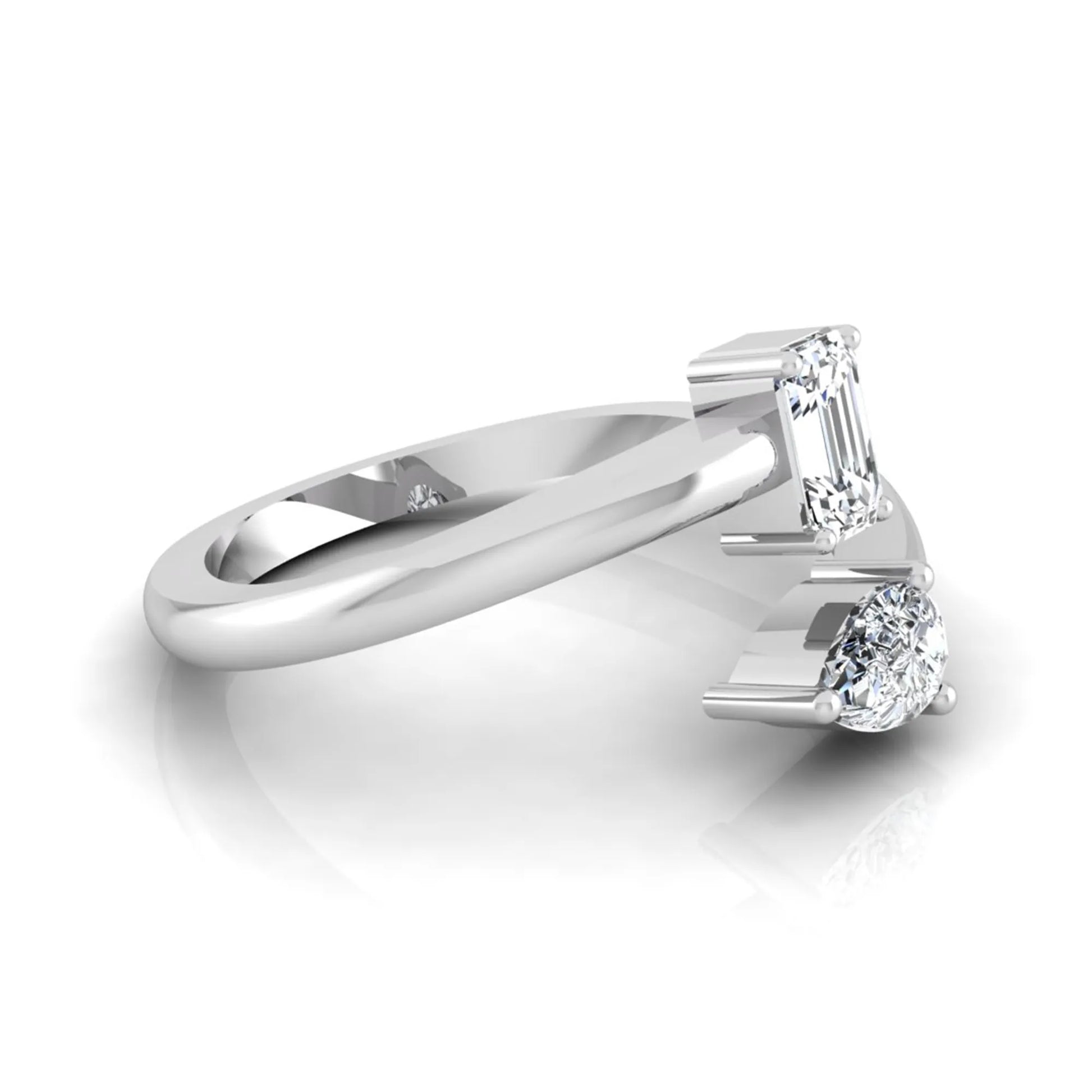 Emerald and pear cut lab grown diamond Toi et Moi ring featuring a minimalist open design in white gold