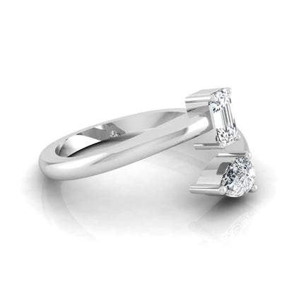 Emerald and pear cut lab grown diamond Toi et Moi ring featuring a minimalist open design in white gold