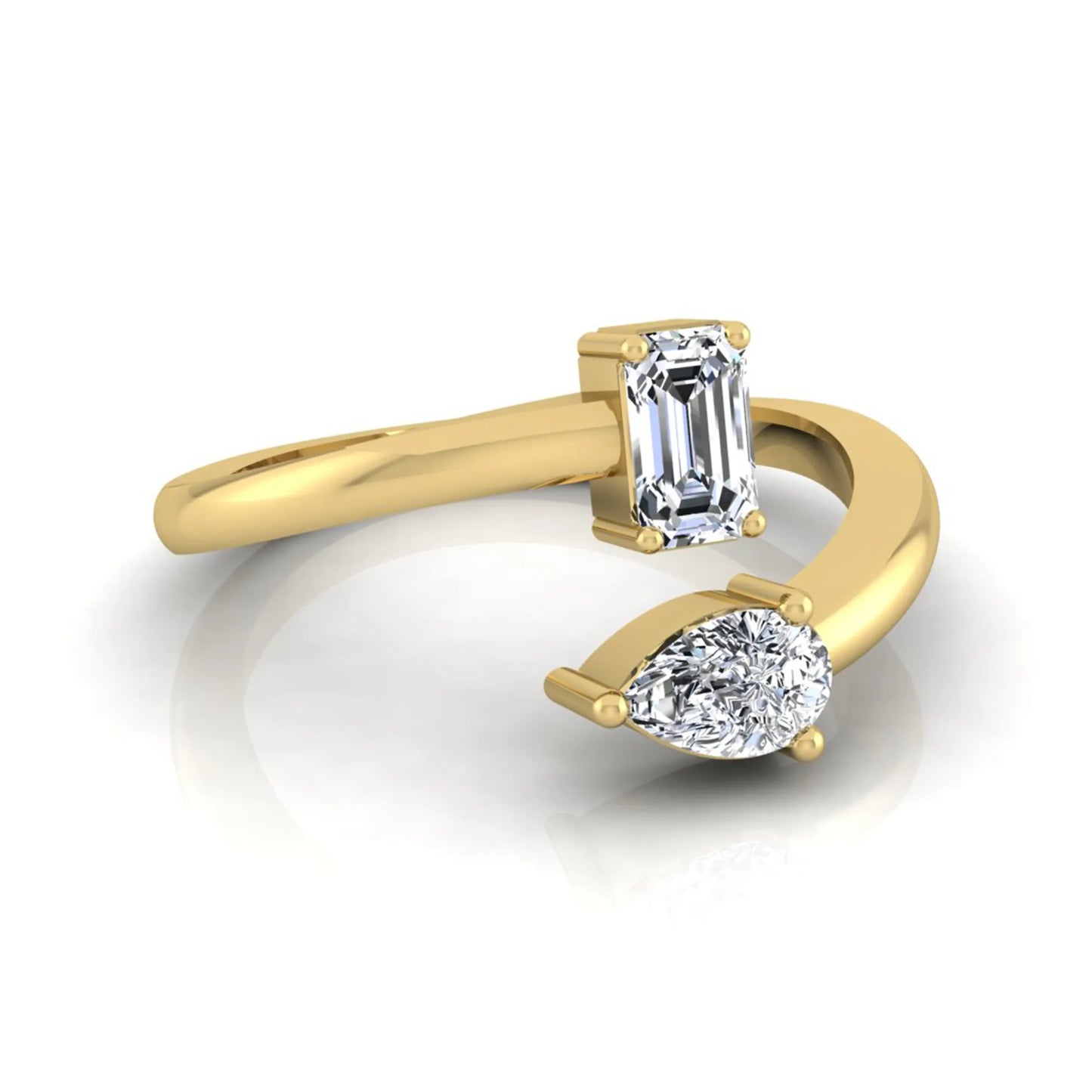 Emerald and pear cut lab grown diamond Toi et Moi ring featuring a minimalist open design in yellow gold